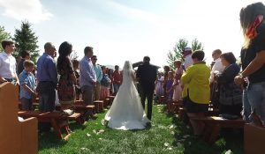 Wedding video captured as father and daughter walk down the aisle.